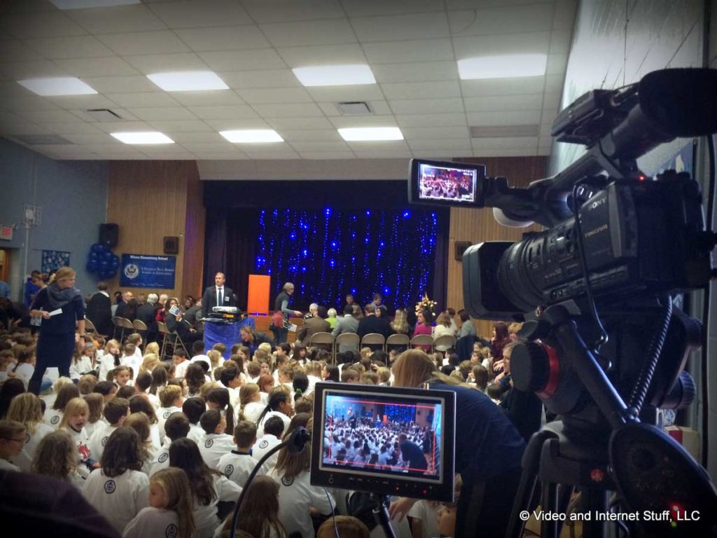 Video production taking place at a school event.